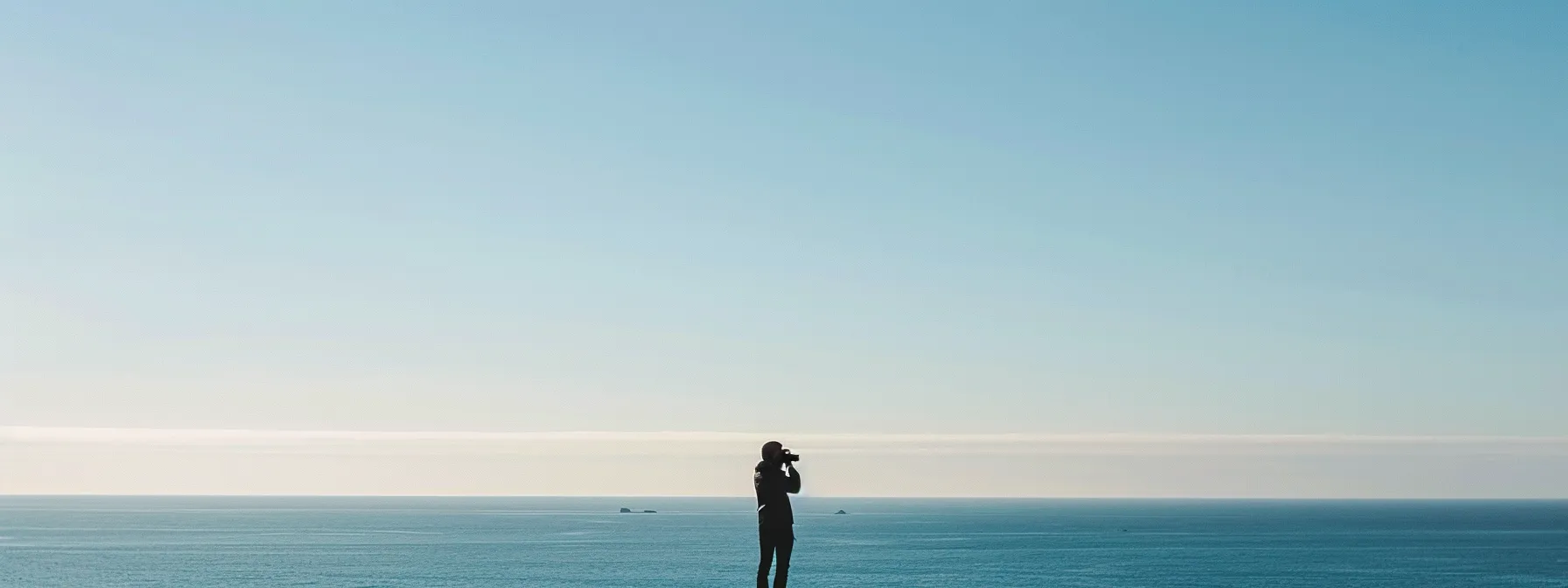 standing atop cape lookout during peak whale-watching season, binoculars in hand, mesmerized by the graceful humpback whales in the distance. standing atop cape lookout during peak whale-watching season, binoculars in hand, mesmerized by the graceful humpback whales in the distance.